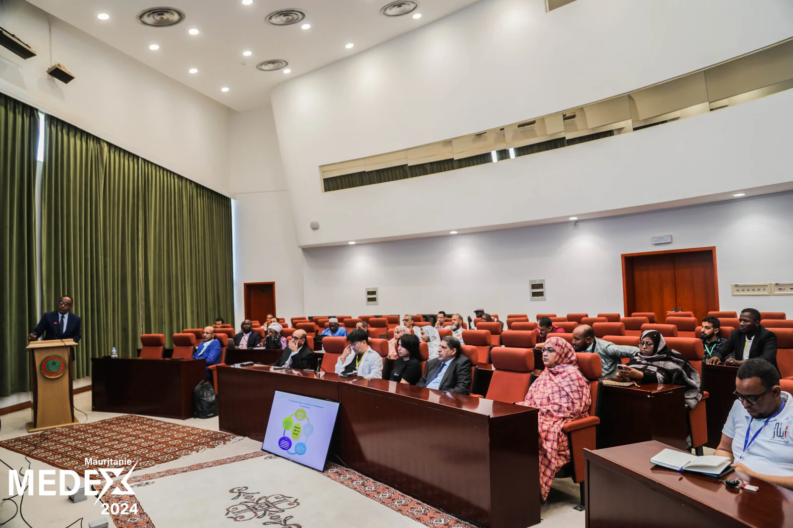 Scientific programme session in the conference auditorium
