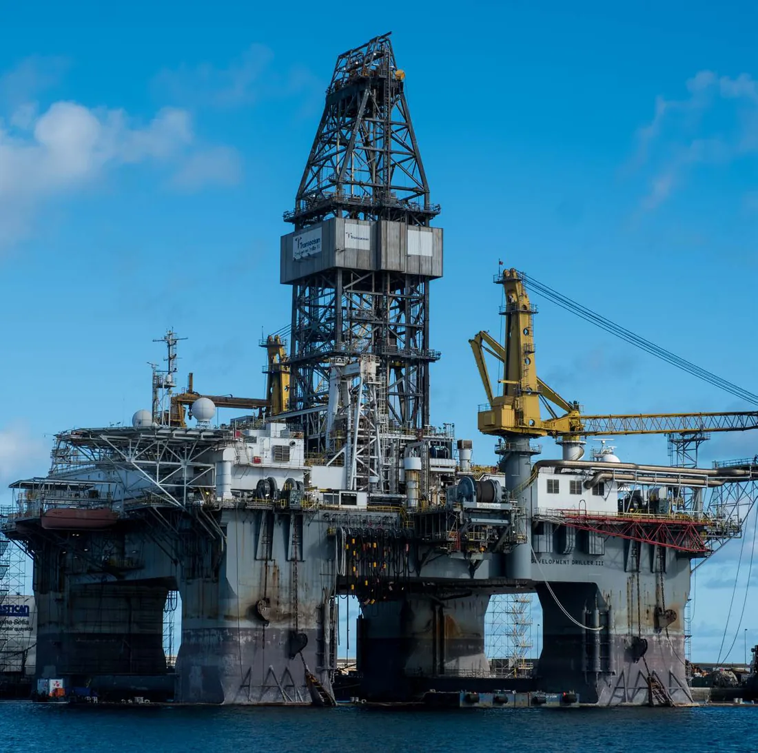 A semi-submersible drilling rig alongside in Las Palmas for repair and maintenance — the ship-repair capability the catalogue puts forward.